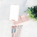 Rotating LED Vanity Mirror with 5 Cosmetic Brushes Portable Travel Makeup Mirror with Light Pink